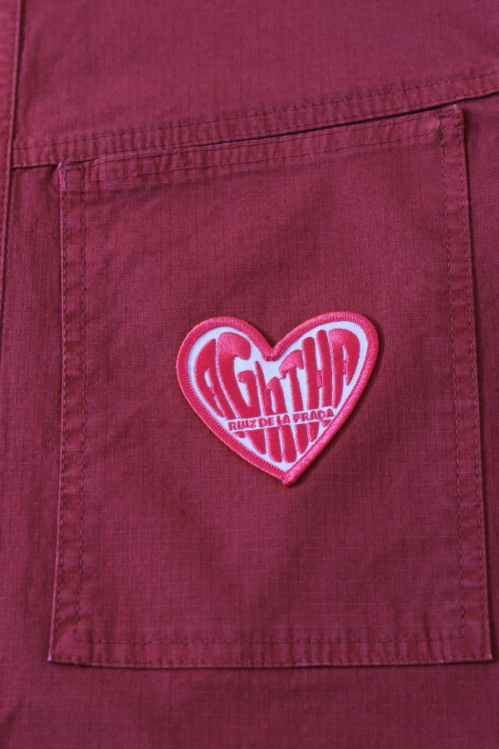 7030877